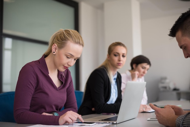 Construction financial statements and progress completion charts on a project manager's desk